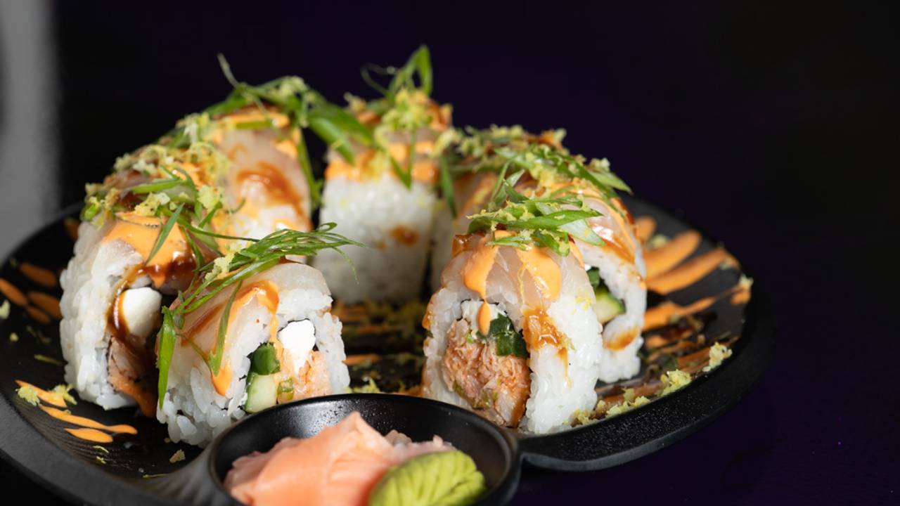 Riceworks Sushi and Asian Fusion Steakhouse signature dishes  Prime Rib, Bulgogi Dragon Fries, various Sushi selections.